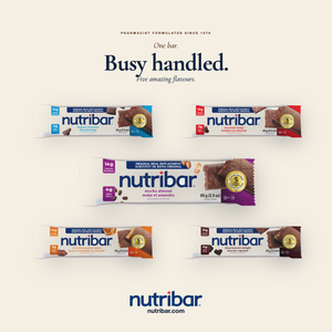 Five Nutribar packages on a white background with the brand name and tagline.