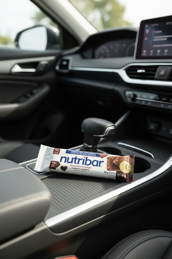 Nutribar package on a car dashboard with a blurred background